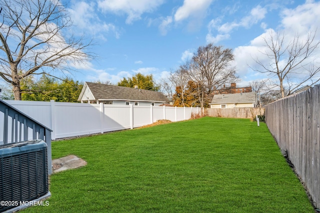 view of yard featuring central AC