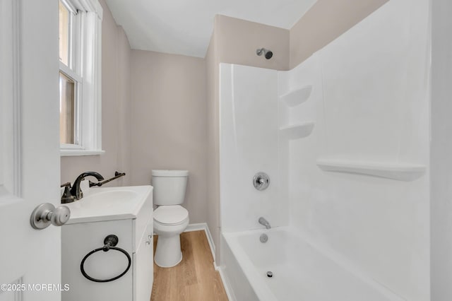 full bathroom featuring shower / bathtub combination, vanity, toilet, and hardwood / wood-style floors