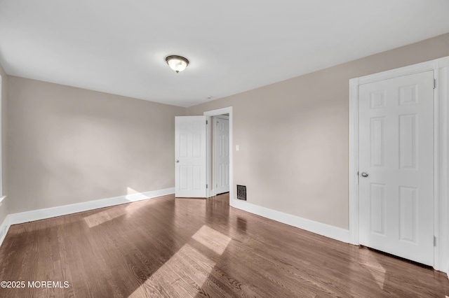 unfurnished room featuring hardwood / wood-style floors