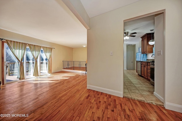 interior space featuring ceiling fan and light hardwood / wood-style flooring