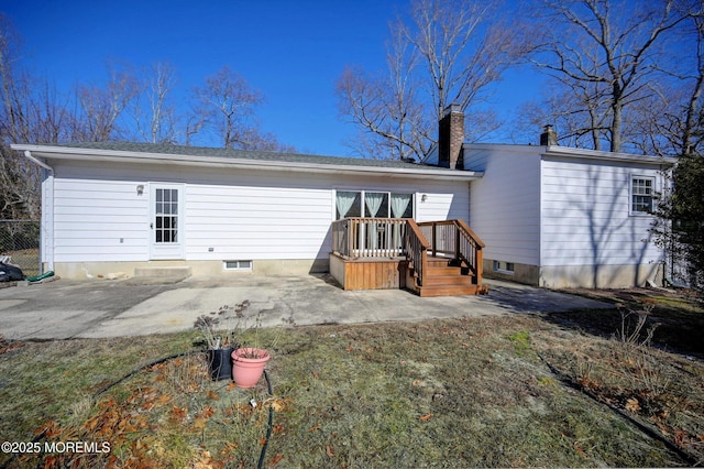 rear view of property featuring a patio area