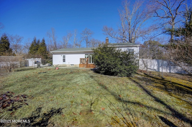 rear view of house with a lawn