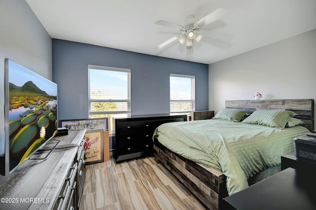 bedroom featuring light wood-type flooring and ceiling fan