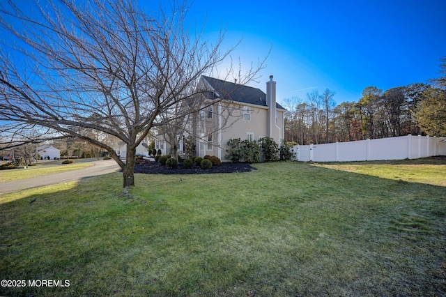 view of property exterior featuring a lawn