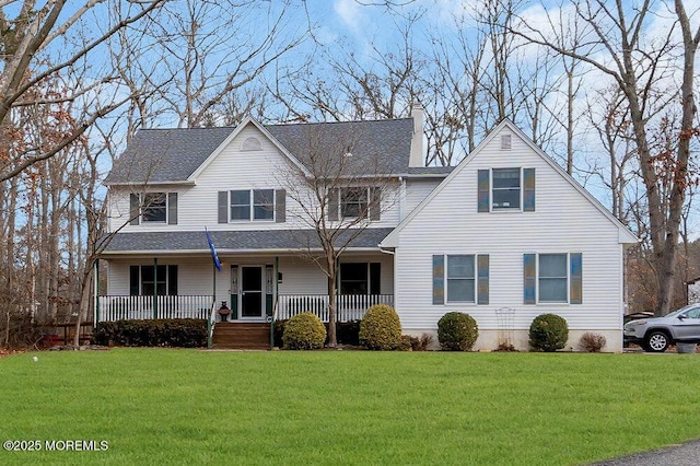 view of front facade with covered porch and a front lawn