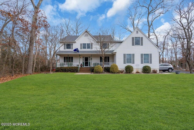 view of front of property with covered porch and a front lawn