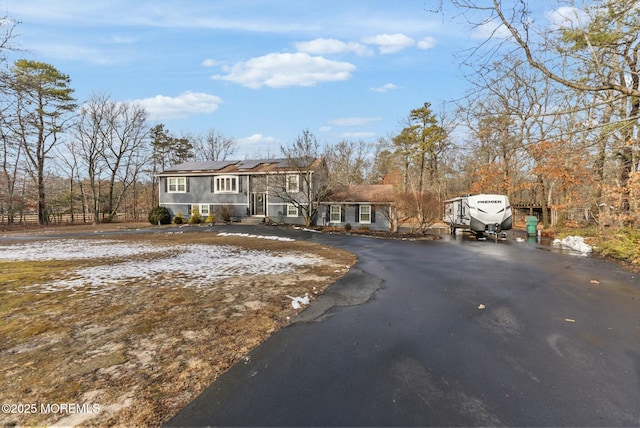 view of front of home featuring solar panels