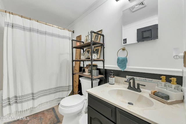 bathroom with vanity, a shower with curtain, crown molding, and toilet