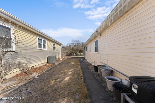 view of property exterior with central AC