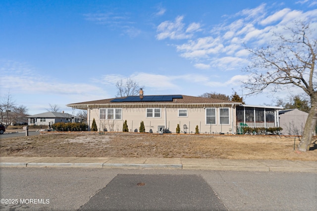 manufactured / mobile home with a sunroom and solar panels