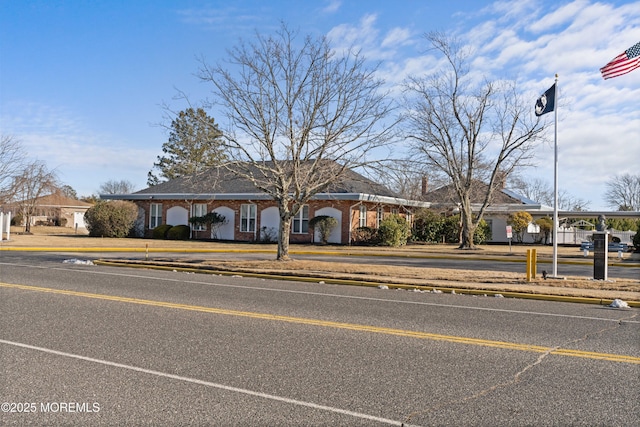 single story home featuring a carport