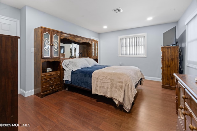 bedroom featuring dark wood-type flooring