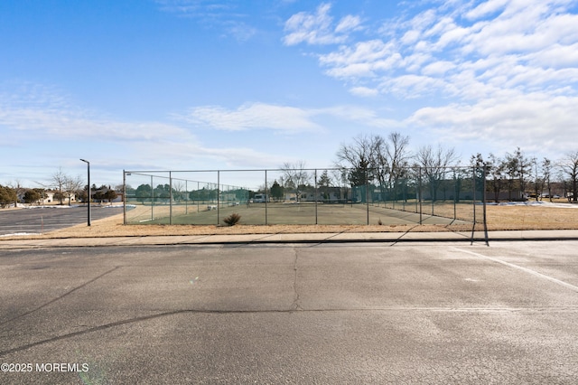 view of community with tennis court