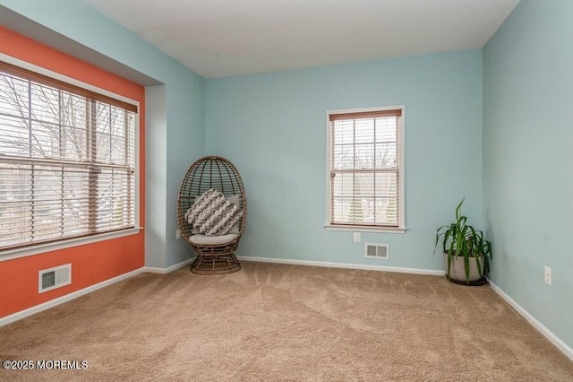 unfurnished room featuring light colored carpet