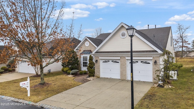 view of front of house with a front lawn and a garage