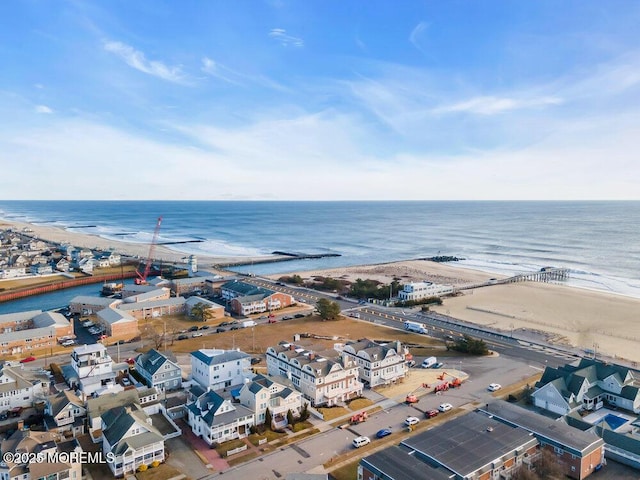 aerial view with a view of the beach and a water view