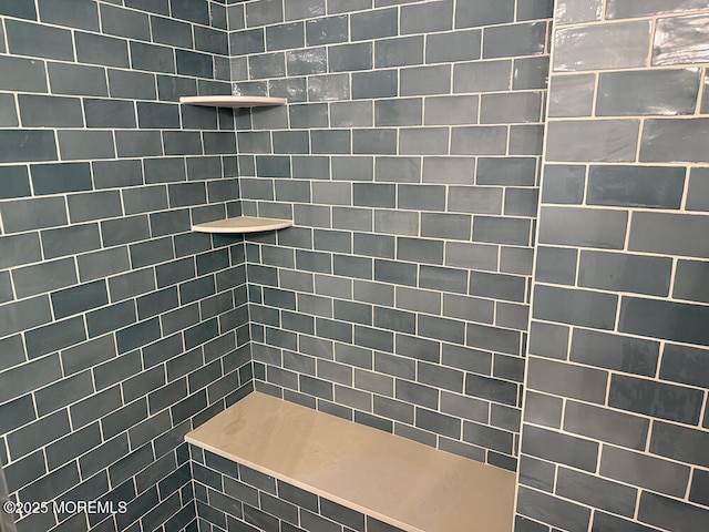 full bath with tiled shower