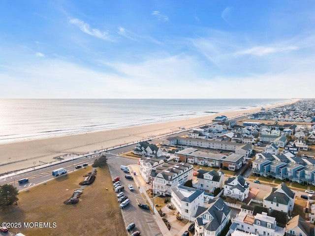 aerial view featuring a water view and a view of the beach