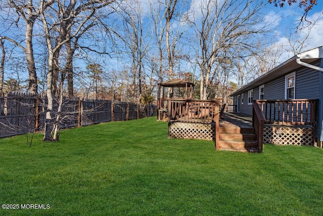 view of yard featuring a wooden deck