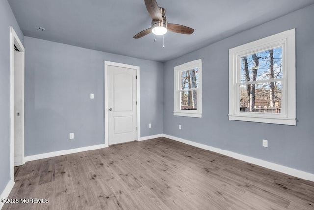 interior space featuring light wood-type flooring and ceiling fan