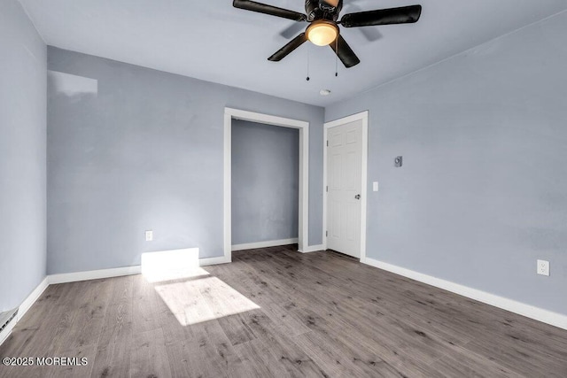 interior space with a closet, ceiling fan, and wood-type flooring