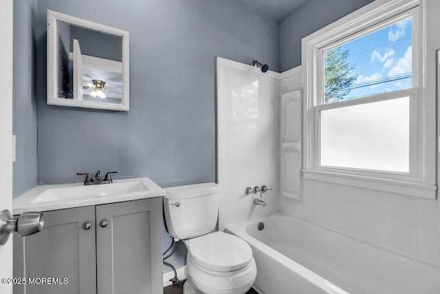 full bathroom featuring toilet, vanity, and tub / shower combination