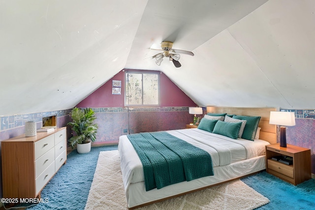 carpeted bedroom featuring lofted ceiling