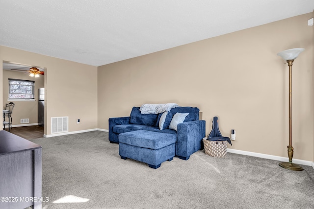 sitting room featuring carpet floors and ceiling fan