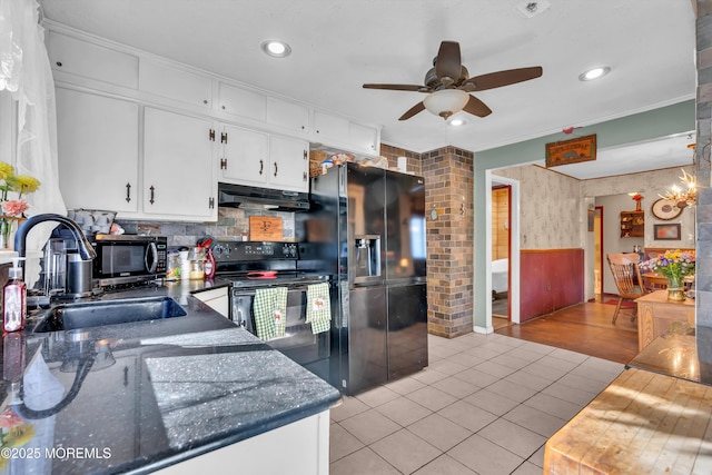 kitchen with white cabinets, fridge with ice dispenser, black electric range, under cabinet range hood, and a sink