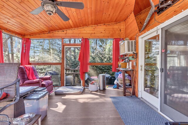 sunroom / solarium featuring vaulted ceiling, wood ceiling, and a wealth of natural light