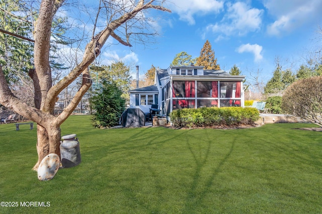 view of yard featuring a sunroom