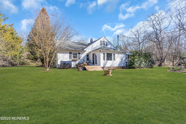 exterior space with a chimney and a yard