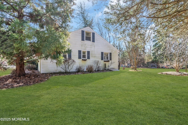 view of home's exterior with a yard