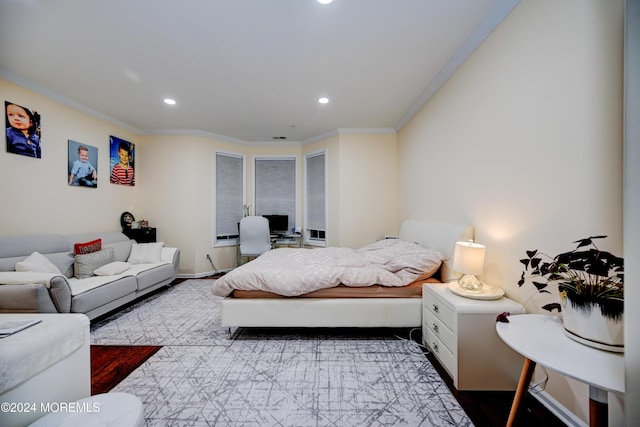 bedroom featuring crown molding and hardwood / wood-style floors