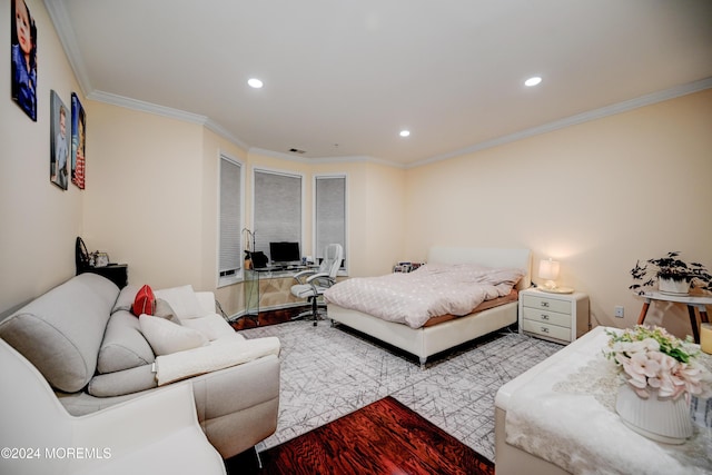 bedroom featuring crown molding and light wood-type flooring