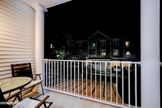 view of balcony at twilight