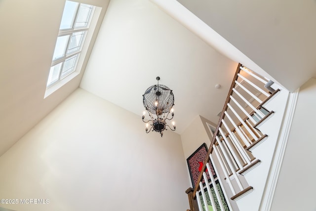 interior details featuring an inviting chandelier