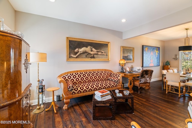 living room featuring beamed ceiling, recessed lighting, wood finished floors, and baseboards