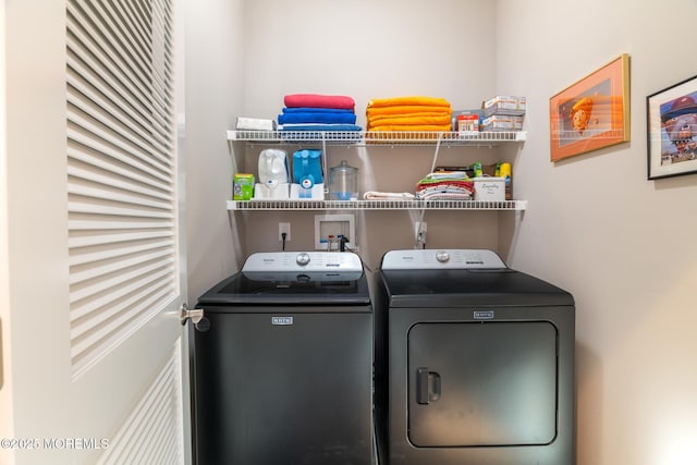 washroom with laundry area and washer and dryer