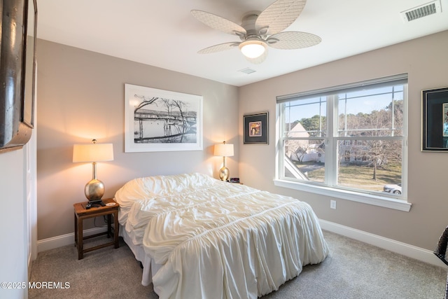 bedroom with carpet, visible vents, and baseboards