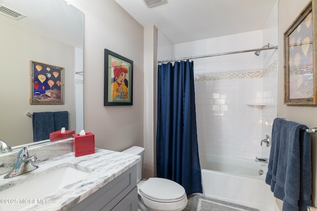 bathroom featuring toilet, shower / tub combo, visible vents, and vanity