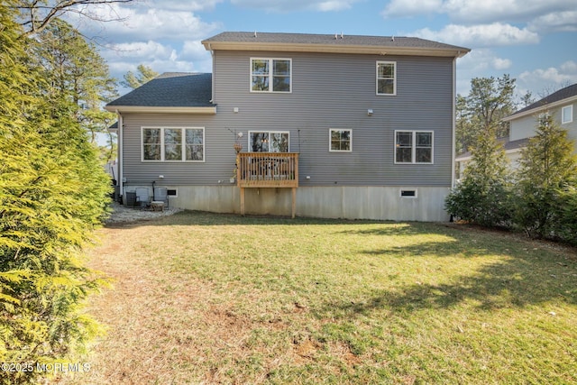 rear view of house with a yard