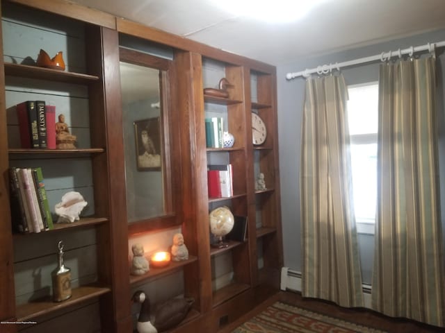 sitting room featuring a baseboard heating unit