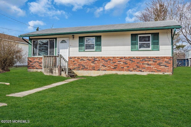 ranch-style house with a front lawn and brick siding