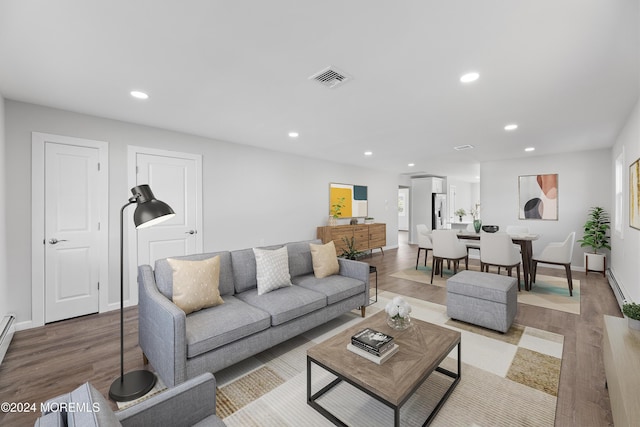 living room with light hardwood / wood-style flooring