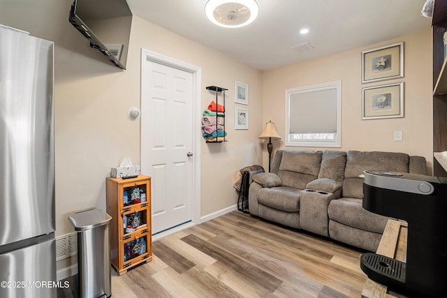 living room with light hardwood / wood-style floors