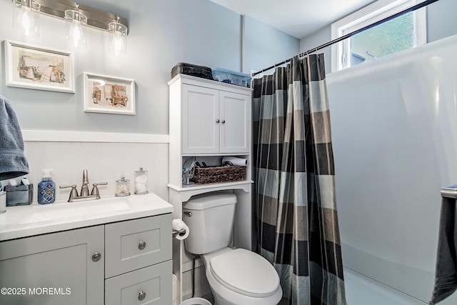 bathroom featuring toilet and vanity