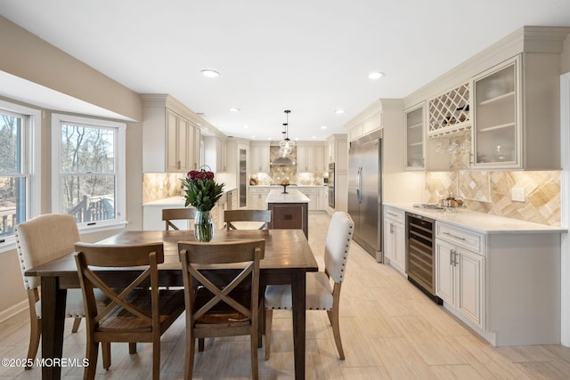 dining area with wine cooler and indoor bar