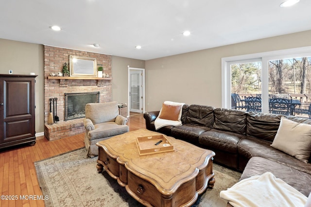 living room featuring a fireplace and light hardwood / wood-style floors