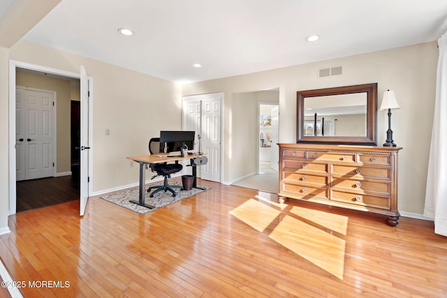 office area with wood-type flooring